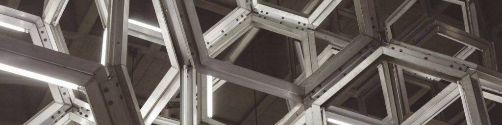 Metal meshing tied to a ceiling illustrating frameworks